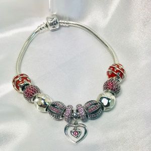 Pandora Bracelet with 10 Pandora Charm Beads.
